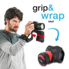 Serves as a camera grip (wrist strap) which morphs into a compact and padded camera carrier.