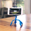 A mounted smartphone on a Splat flexible tripod playing a movie.